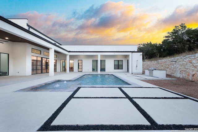 1356 Capitare, New Braunfels, TX 78132 - pool at dusk with a patio area and an outdoor pool