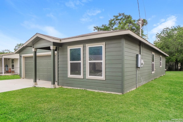 237 Corliss, San Antonio, TX 78220 - view of side of property featuring an attached garage, concrete driveway, and a yard