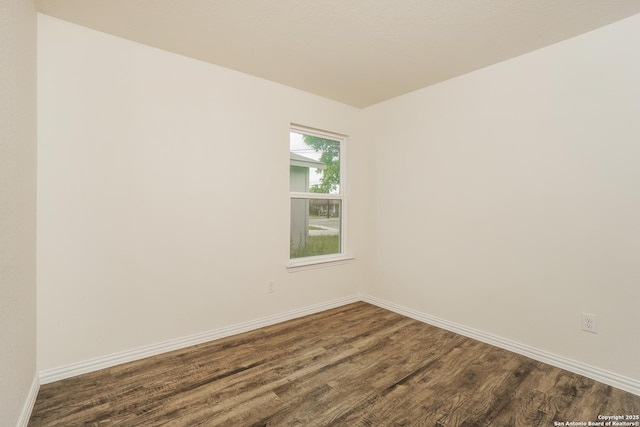237 Corliss, San Antonio, TX 78220 - unfurnished room with dark wood-style flooring and baseboards