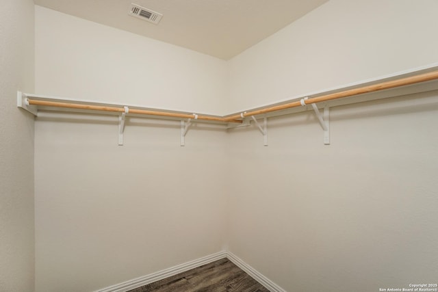 237 Corliss, San Antonio, TX 78220 - walk in closet with dark wood-style flooring
