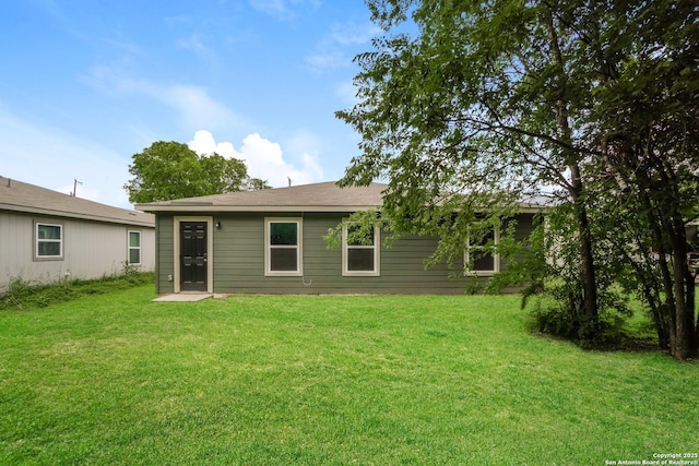 237 Corliss, San Antonio, TX 78220 - rear view of house with a yard
