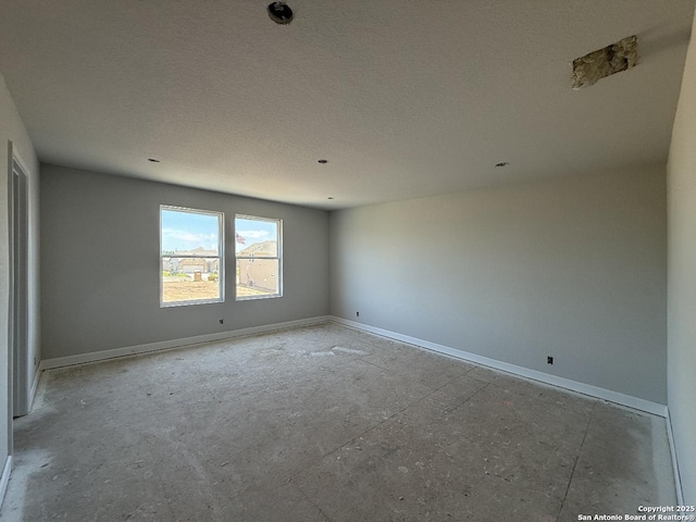 14724 Sycamore Xing, San Antonio, TX 78252 - empty room with baseboards and a textured ceiling