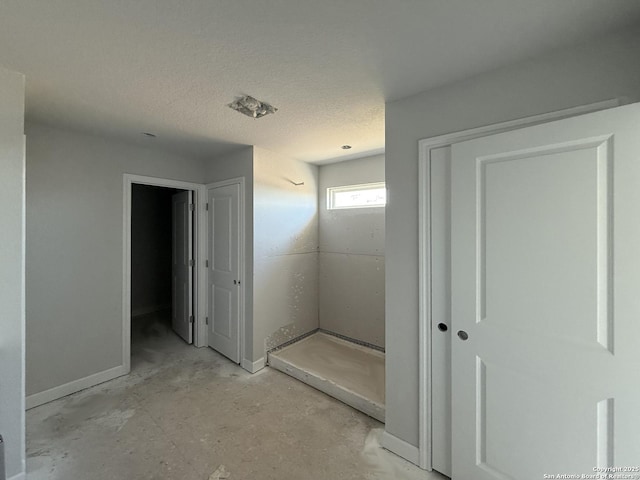 14724 Sycamore Xing, San Antonio, TX 78252 - bathroom featuring concrete flooring, baseboards, and a textured ceiling