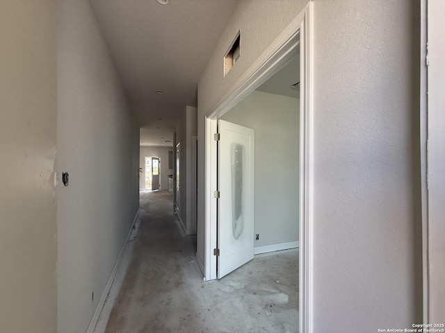 14724 Sycamore Xing, San Antonio, TX 78252 - hallway with concrete floors and baseboards