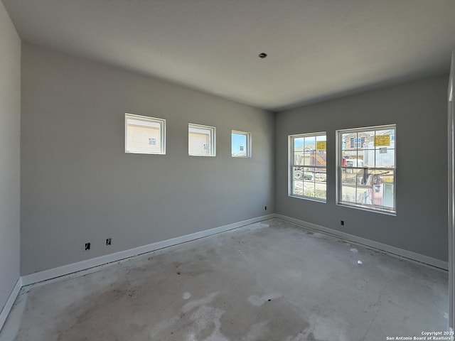 14724 Sycamore Xing, San Antonio, TX 78252 - unfurnished room featuring baseboards and unfinished concrete flooring