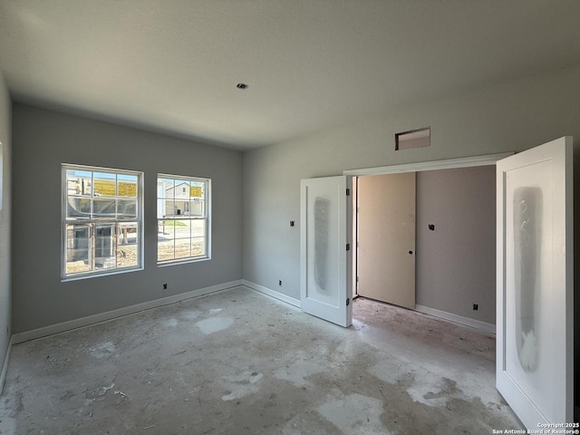 14724 Sycamore Xing, San Antonio, TX 78252 - unfurnished bedroom with unfinished concrete floors