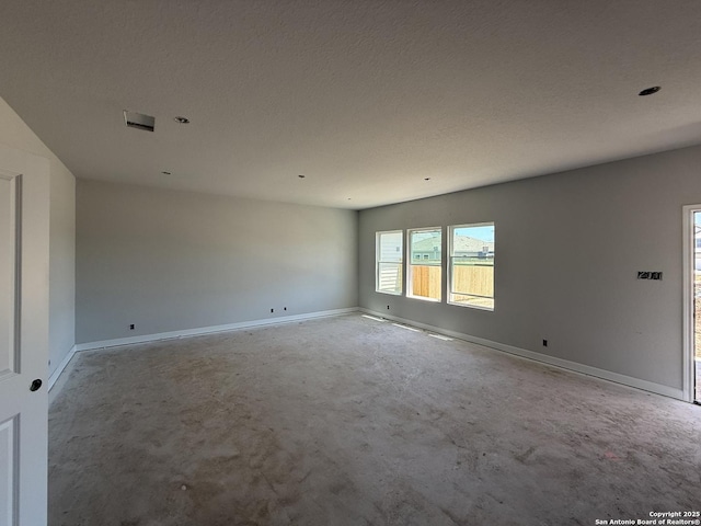 14724 Sycamore Xing, San Antonio, TX 78252 - spare room with concrete floors and baseboards