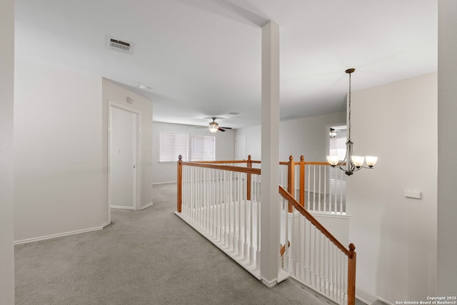 17223 Darlington Run, San Antonio, TX 78247 - hallway featuring an upstairs landing, carpet flooring, baseboards, and a chandelier