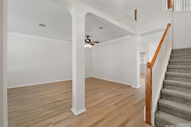 17223 Darlington Run, San Antonio, TX 78247 - staircase with a ceiling fan, wood finished floors, crown molding, and baseboards