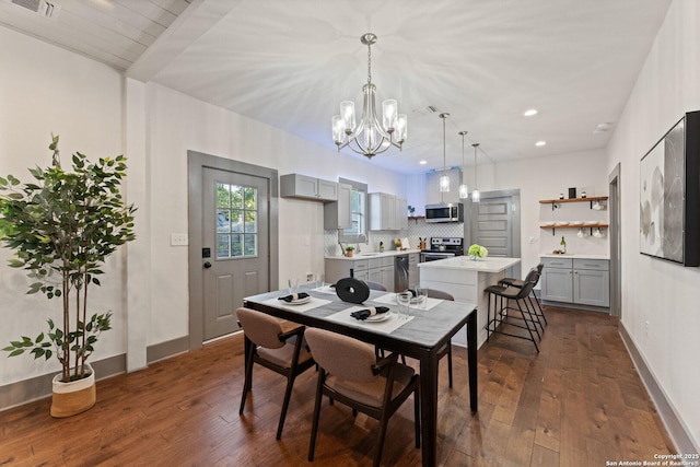 631 Muncey St, San Antonio, TX 78202 - dining area featuring a chandelier, dark wood-type flooring, baseboards, and recessed lighting