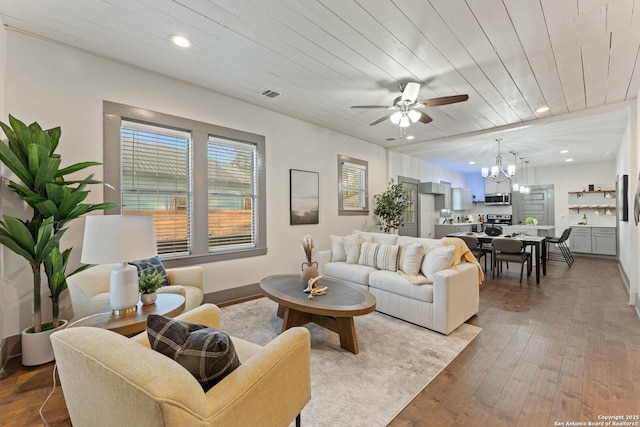 631 Muncey St, San Antonio, TX 78202 - living room featuring a chandelier, ceiling fan, wood finished floors, recessed lighting, and baseboards