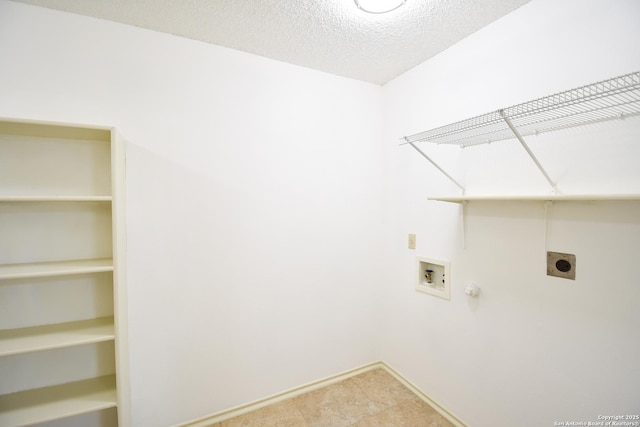 15850 Marisa Pl, San Antonio, TX 78247 - clothes washing area with hookup for an electric dryer, washer hookup, hookup for a gas dryer, baseboards, and a textured ceiling