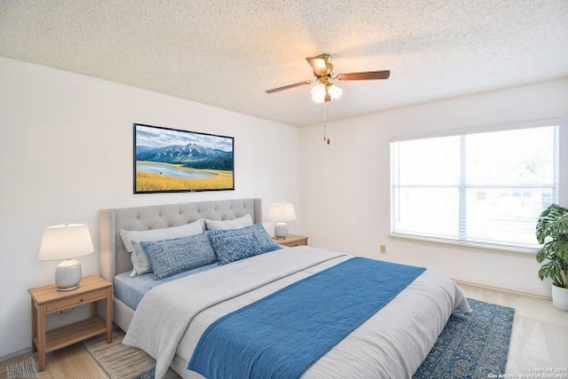 15850 Marisa Pl, San Antonio, TX 78247 - bedroom with a textured ceiling and a ceiling fan