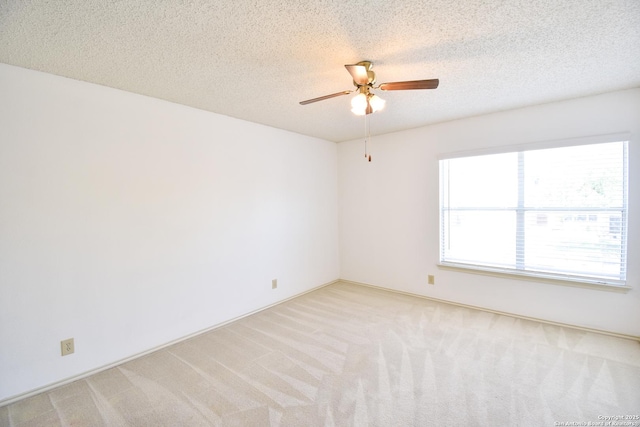 15850 Marisa Pl, San Antonio, TX 78247 - empty room featuring a ceiling fan, light colored carpet, and a textured ceiling