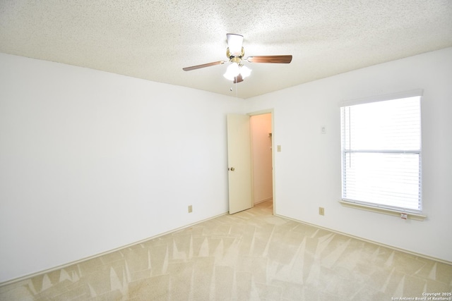 15850 Marisa Pl, San Antonio, TX 78247 - unfurnished room with ceiling fan, light colored carpet, and a textured ceiling