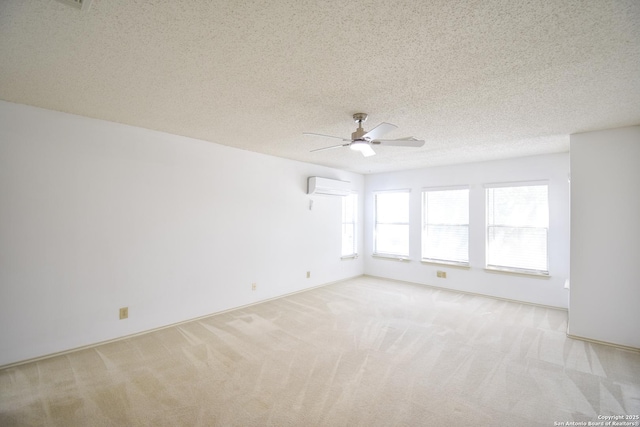 15850 Marisa Pl, San Antonio, TX 78247 - empty room featuring a wall unit AC, light colored carpet, a ceiling fan, and a textured ceiling