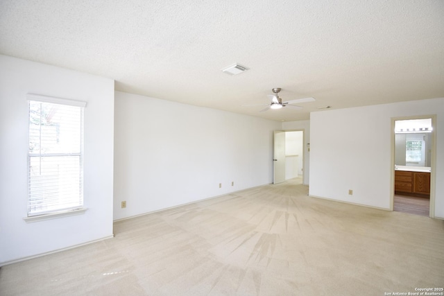 15850 Marisa Pl, San Antonio, TX 78247 - empty room with a textured ceiling, light carpet, and ceiling fan