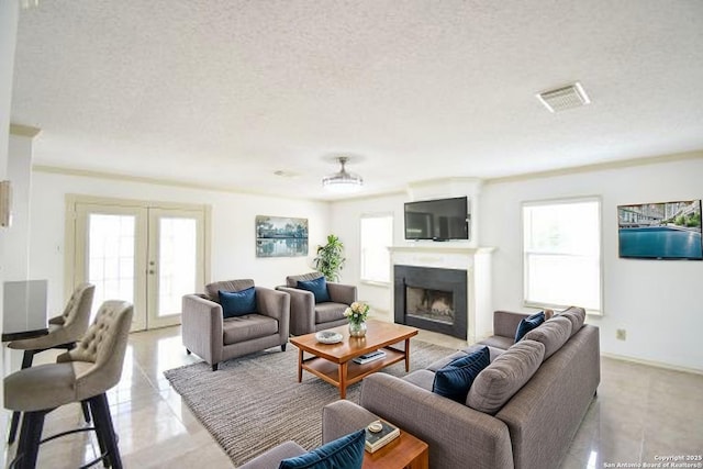 15850 Marisa Pl, San Antonio, TX 78247 - living area featuring french doors, a fireplace, a textured ceiling, and light tile patterned floors