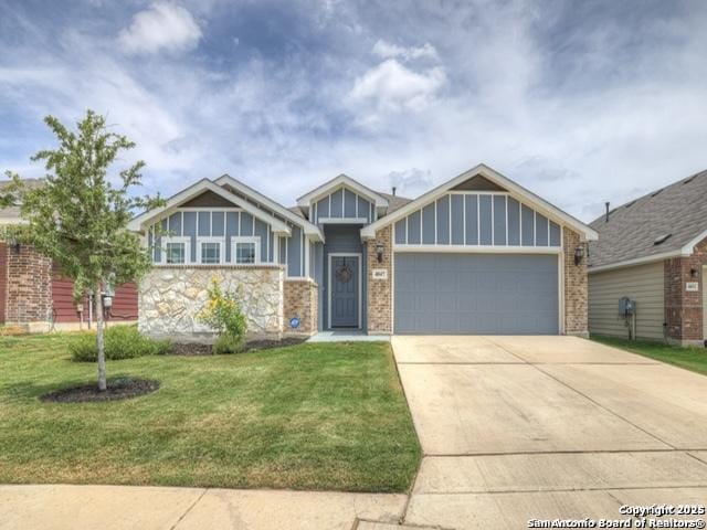 4047 Legend Mdws, New Braunfels, TX 78130 - view of front of home featuring an attached garage, a front yard, concrete driveway, stone siding, and brick siding