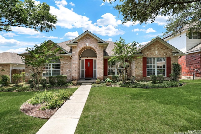 4635 Shavano Birch, San Antonio, TX 78230 - traditional-style home featuring brick siding, a front lawn, and a shingled roof