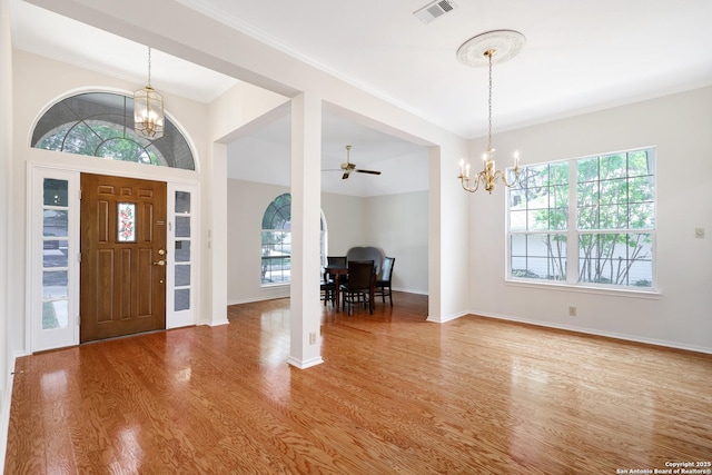 4635 Shavano Birch, San Antonio, TX 78230 - entryway with a chandelier, wood finished floors, plenty of natural light, and ornamental molding