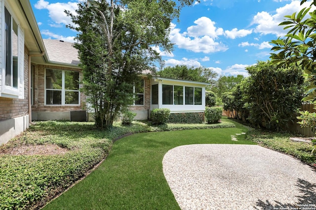 4635 Shavano Birch, San Antonio, TX 78230 - view of green lawn with a patio area and a sunroom