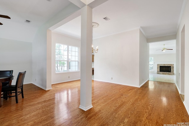 4635 Shavano Birch, San Antonio, TX 78230 - living area with a ceiling fan, wood finished floors, a fireplace, ornamental molding, and baseboards