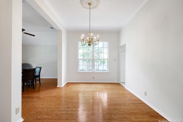 4635 Shavano Birch, San Antonio, TX 78230 - dining area with a chandelier, wood finished floors, ornamental molding, a ceiling fan, and baseboards