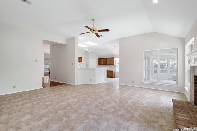 4635 Shavano Birch, San Antonio, TX 78230 - unfurnished living room featuring ceiling fan, vaulted ceiling, a fireplace, and light tile patterned flooring