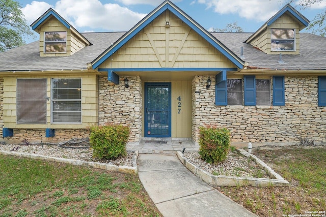 427 Indigo, San Antonio, TX 78216 - view of front of house featuring stone siding and roof with shingles