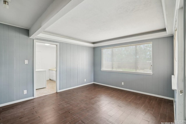 427 Indigo, San Antonio, TX 78216 - unfurnished room featuring wood finished floors, baseboards, wooden walls, and beam ceiling