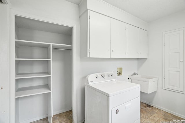 427 Indigo, San Antonio, TX 78216 - laundry room with washer / clothes dryer, cabinet space, and baseboards