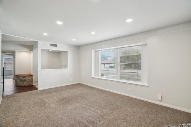 427 Indigo, San Antonio, TX 78216 - unfurnished room featuring dark carpet, recessed lighting, and baseboards