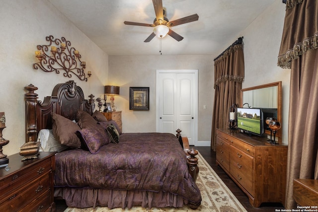 2219 Clubs Dr, Boerne, TX 78006 - bedroom with dark wood finished floors and a ceiling fan