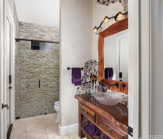 2219 Clubs Dr, Boerne, TX 78006 - full bath featuring toilet, a stall shower, vanity, and baseboards