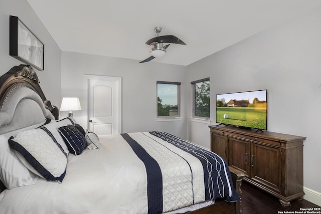 2219 Clubs Dr, Boerne, TX 78006 - bedroom with dark wood-style floors, ceiling fan, and baseboards