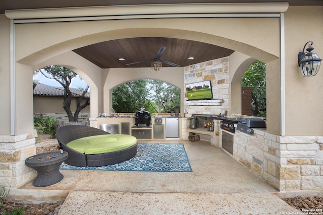 2219 Clubs Dr, Boerne, TX 78006 - view of patio with an outdoor kitchen, a ceiling fan, and area for grilling