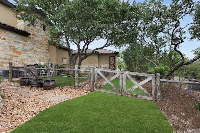 2219 Clubs Dr, Boerne, TX 78006 - view of yard with a gate and central air condition unit