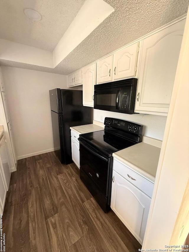 kitchen with black appliances, a textured ceiling, white cabinetry, dark wood-type flooring, and light countertops