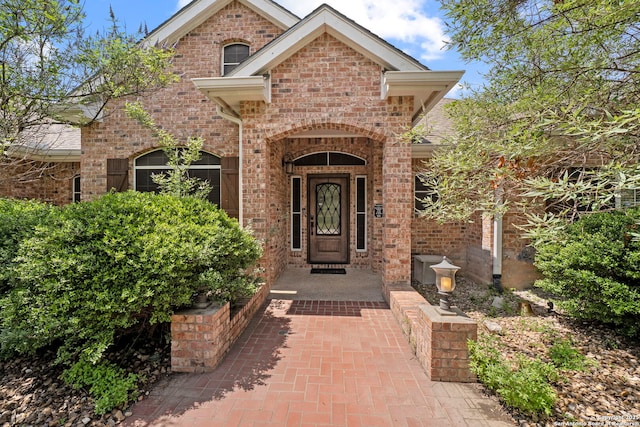 9403 Gardenia Bnd, San Antonio, TX 78266 - doorway to property with brick siding