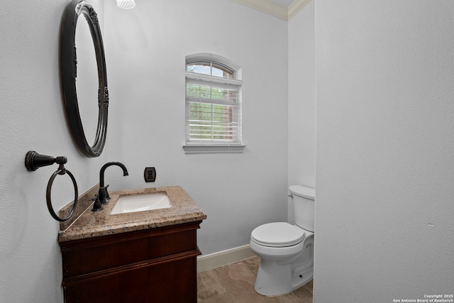 9403 Gardenia Bnd, San Antonio, TX 78266 - half bath featuring toilet, vanity, baseboards, and crown molding