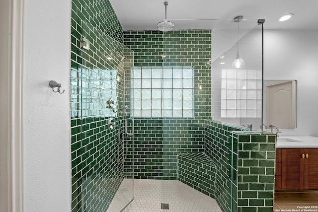 9403 Gardenia Bnd, San Antonio, TX 78266 - full bath with a tile shower, tile patterned flooring, and vanity