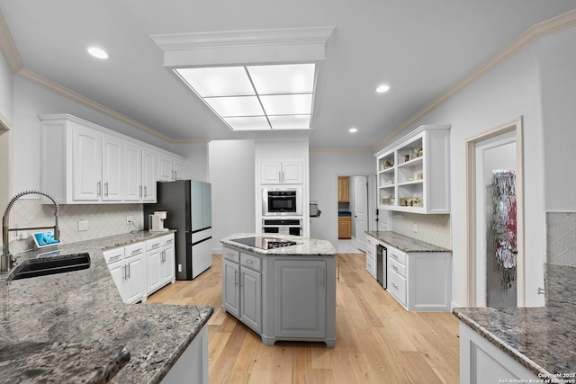 9403 Gardenia Bnd, San Antonio, TX 78266 - kitchen with a sink, white cabinetry, decorative backsplash, beverage cooler, and ornamental molding