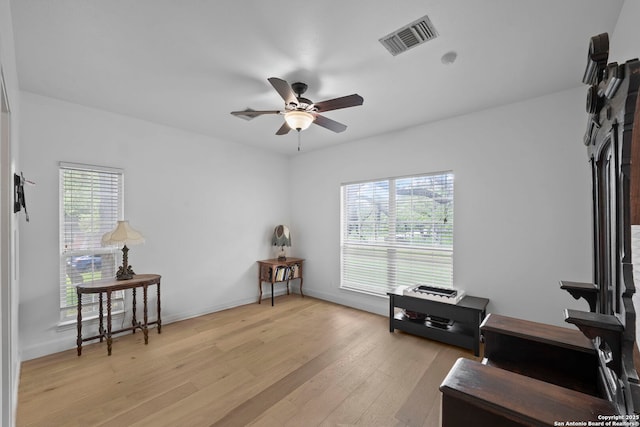 9403 Gardenia Bnd, San Antonio, TX 78266 - sitting room with ceiling fan, light wood-style floors, and baseboards