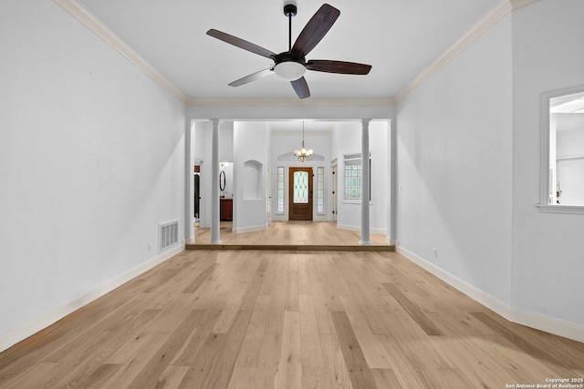 9403 Gardenia Bnd, San Antonio, TX 78266 - unfurnished living room featuring light wood-type flooring, a chandelier, crown molding, ornate columns, and baseboards