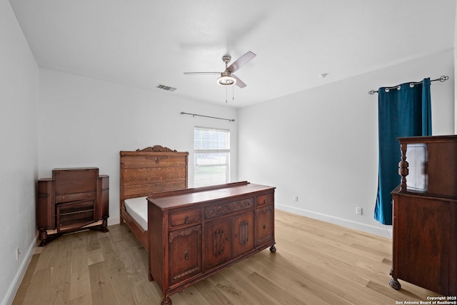 9403 Gardenia Bnd, San Antonio, TX 78266 - bedroom with light wood-type flooring, baseboards, and ceiling fan