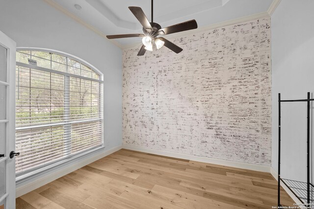 9403 Gardenia Bnd, San Antonio, TX 78266 - unfurnished room with a ceiling fan, baseboards, light wood finished floors, ornamental molding, and wallpapered walls