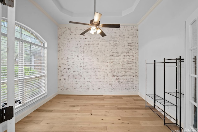 9403 Gardenia Bnd, San Antonio, TX 78266 - unfurnished room with a tray ceiling, ceiling fan, light wood finished floors, baseboards, and ornamental molding