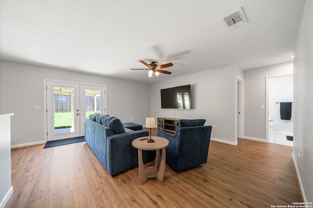 5902 Brambletree, San Antonio, TX 78247 - living room with french doors, wood finished floors, a ceiling fan, and baseboards