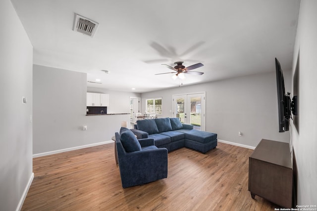 5902 Brambletree, San Antonio, TX 78247 - living room featuring baseboards, ceiling fan, and light wood-style flooring